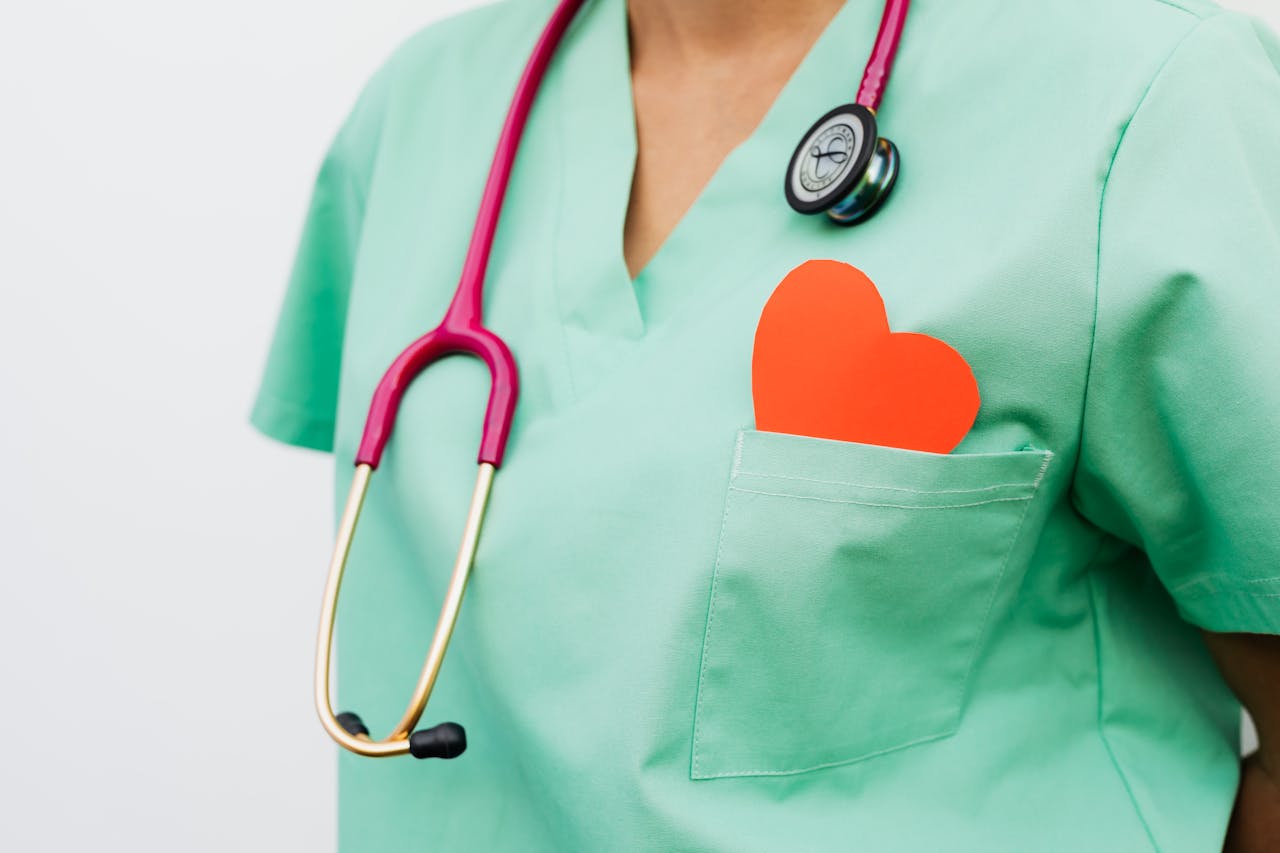 services-02 A healthcare professional with a stethoscope and red heart symbol emphasizes cardiology care.